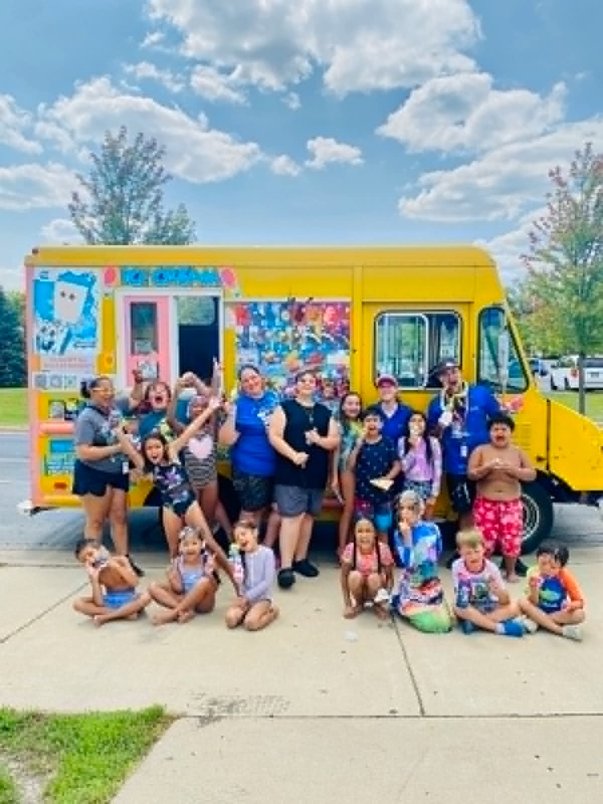 Kids and families gathered around the Palatine Ice Cream Truck at a summer neighborhood event